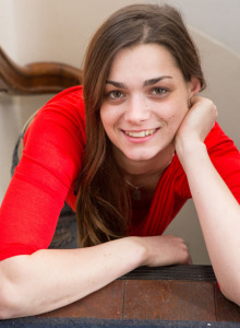 Exciting beauty Evi in red blouse, denim jeans and pink panties strips to show erected nipples